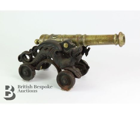 Model of an eastern brass rampart cannon, late 19th entury, The brass barrel measures approx 39 cms in length, mounted an an 