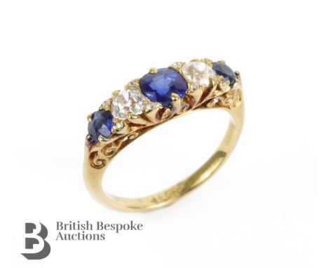 Antique 18ct yellow gold peacock blue sapphire and diamond ring. The ring set with a central sapphire approx 4.8 mm and flank