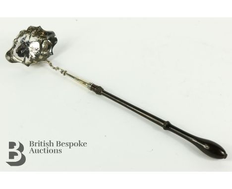 Silver punch ladle, marks rubbed, circa 1789 according to a paper label, with turned handle, approx 36 cms.&nbsp;