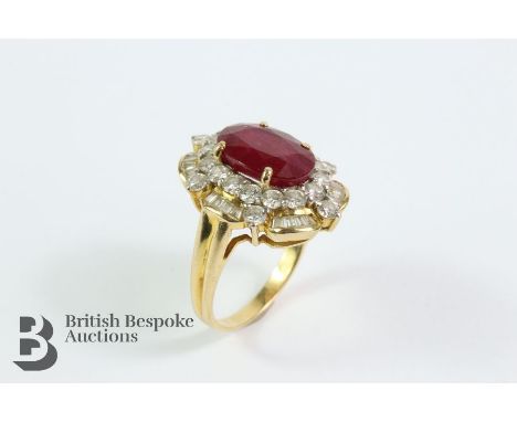 18ct yellow gold diamond and ruby ring. The oval ruby measuring 10.88 x 7.5mm 4.05 ct, in a stepped mount, framed by baguette