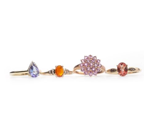 FOUR GEM SET RINGS, including one set with a central orange gem on diamond shoulders, size R, all marked for nine carat gold,