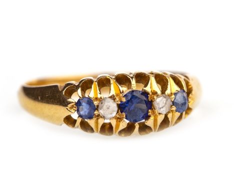 VICTORIAN BLUE GEM AND DIAMOND RING, the boat shaped setting with three graduated round blue gems interspaced by rose cut dia