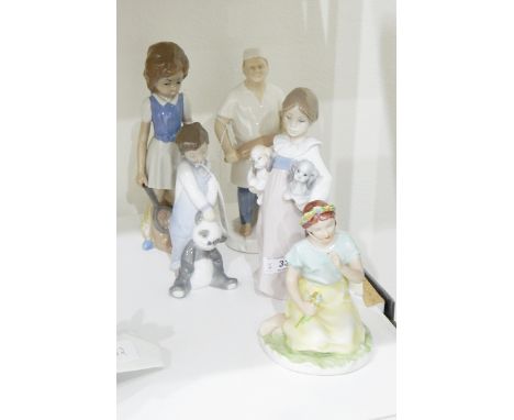 Lladro figure of a little girl holding two puppies, a Lladro figure of a little boy holding a panda bear, a Czechoslovakian f