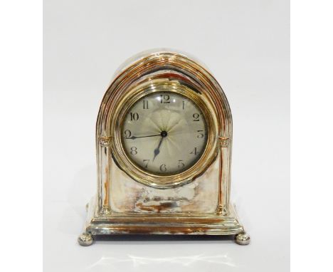 Edwardian mantel clock, the circular dial with engine-turned decoration and Arabic numerals, in arched silver plated case, 19