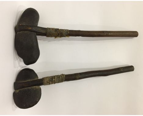 Pair Oceanic stone-head axe-type clubs bound to a wooden shaft with leather and reeds, believed to have belonged to Robert Mo