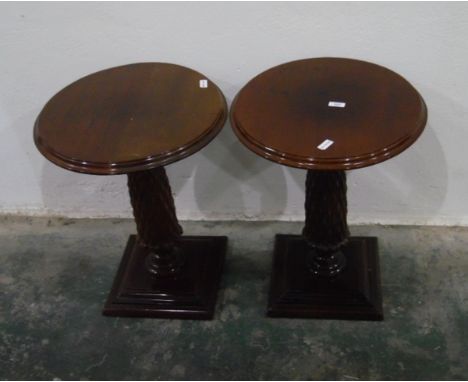 Pair of mahogany circular lamp tables on carved pedestals, with square moulded plinth bases, 46cm diameter 