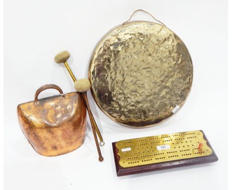 Brass gong of circular form with two beaters, a large copper cow bell and a brass cribbage marker on wooden base (5) 