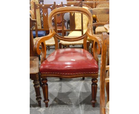 19th century mahogany-framed elbow chair having open scroll arms and on fluted supports with button upholstered leather seat 