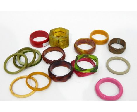 Vintage plastic bracelet formed as mottled green and brown rectangular sections, a metal hinged bangle decorated with water l