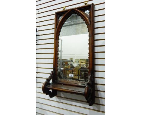 Victorian Gothic-revival carved oak framed wall mirror with lancet-shaped plate, with open shelf below, height 78cm 