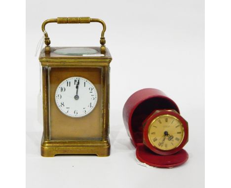 Brass carriage clock, the circular enamel dial with Arabic numerals, 17cm high and a Looping vintage alarm clock, the circula