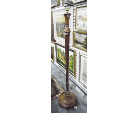 Oak lamp standard with spiral turned column and circular platform base, on scroll feet and another tapering inverted hexagona