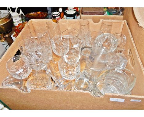 Quantity of assorted moulded and other glass including wines, tumblers, etc., a pair of table lamps, part of a paraffin lamp,