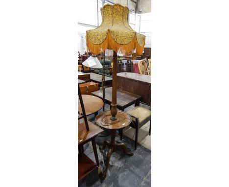 Mahogany lamp standard having turned and fluted column, veneered table-top to mid-stage with piecrust moulded rim and on trip