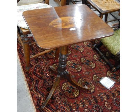 Mahogany tilt-top table on turned pedestal, with outswept tripod supports, the top with oval figured walnut inlay 