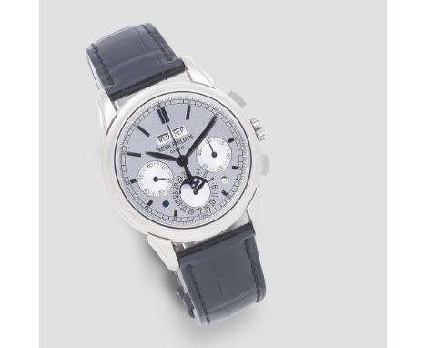 Patek Philippe. A fine and rare 18K white gold manual wind perpetual calendar chronograph wristwatch with moon phaseReference