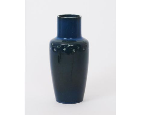 A Ruskin Pottery vase by William Howson Taylor, dated 1916, painted with a band of clover leaf in white on a blue ground with