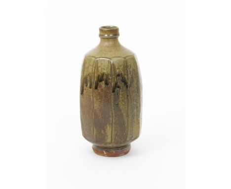 Jim Malone (born 1946) an Ainstable Pottery cut sided stoneware bottle vase, with simple  incised grass design, covered to th