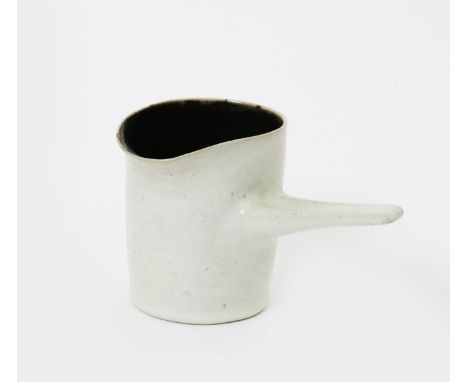 ‡ Dame Lucie Rie DBE (1902-1995) and Hans Coper (1920-1981) a stoneware pouring vessel, glazed speckled white to exterior and