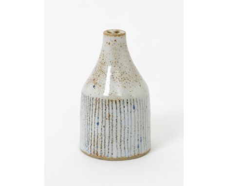 ‡ Dame Lucie Rie DBE (1902-1995 a stoneware pepper pot,  shouldered, cylindrical form white glaze with rust speckles and inla