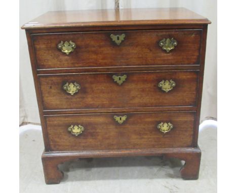 An early 19thC oak chest, comprising three long deep drawers with brass bail handles on pierced backplates, raised on bracket