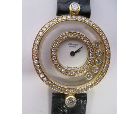 A ladies Chopard of Geneve, Happy Diamonds 18ct gold cased and diamond set wristwatch, no 20/3957, stamped 295251 4097, on a 