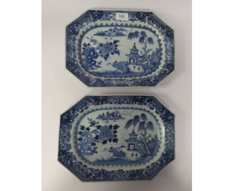 A pair of late 18thC Chinese porcelain plates of elongated octagonal form, decorated in blue and white with a seascape, a lon