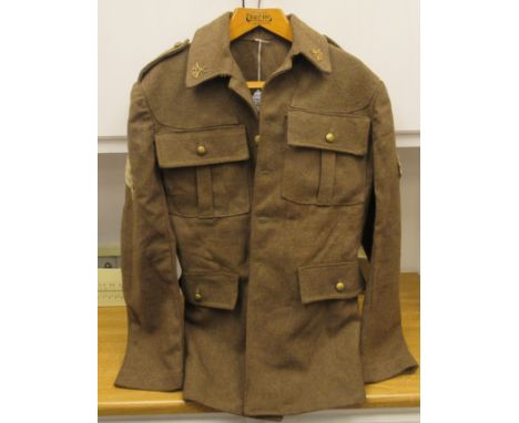 An Army Sergeant's khaki battledress tunic, bears the insignia of the South African Heavy Artillery Regiment (Please Note: th