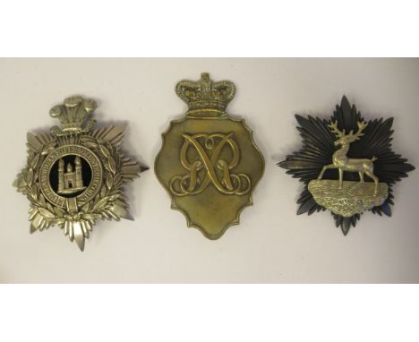 A Glamorgan Rifle Vols. helmet plate; and two dissimilar shako plates (Please Note: this lot is subject to the statement made