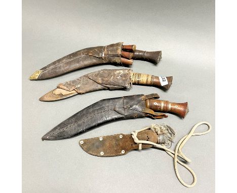 A group of old Gurkha Kukri daggers.