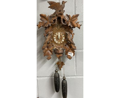 A vintage wooden cuckoo clock, H. 53cm.