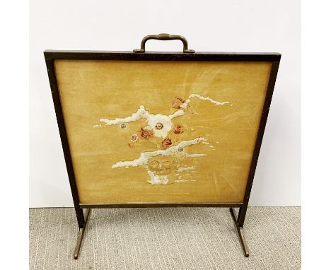 An interesting 1920's brass fire screen with hand painted decoration under glass, W. 51cm H. 60cm.