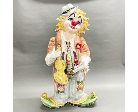 A large Italian ceramic figure of a clown, H. 87cm.
