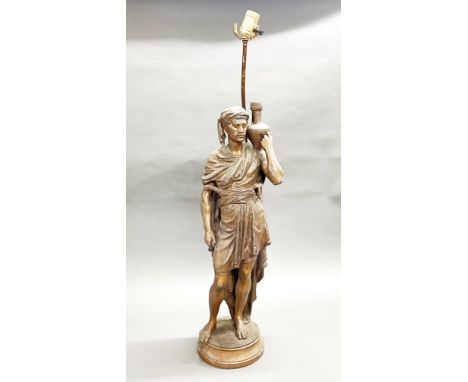 A large 19thC bronze finished spelter figure of an Arab man mounted as a table lamp, figure H. 69cm.