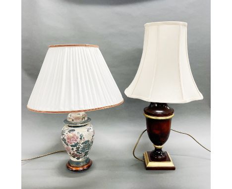 An oriental design porcelain table lamp and shade, H. 61cm. Together with a wooden table lamp and shade.