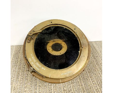 A vintage Azimuth aircraft compass.