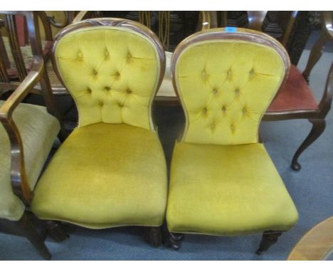 Two Victorian walnut spoon button back salon chairs 