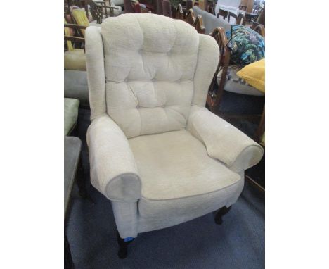 A modern button wingback armchair 