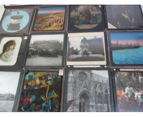 Early 20th century Magic Lantern slides and glass negatives with stereoscopic examples, along with a magic lantern body, stam