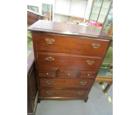 A Stagg mahogany chest of two long drawers above three small central drawers and a further two long drawers on short feet, 44