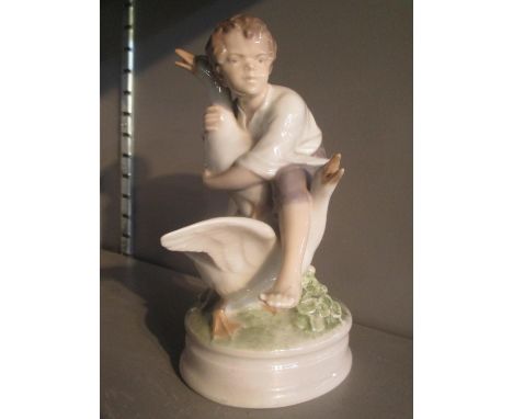 A Royal Copenhagen figure of a boy with two geese, model no 2139 