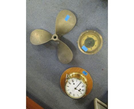 A Schatz brass cased ships clock with key, a pattern 183, no 0133 brass cased ships compass and a brass ships propeller 