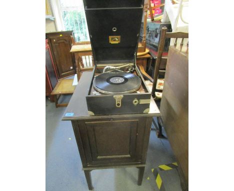 The Barkingside East Light early 20th century oak cased gramophone record cabinet with a selection of 78rpm records, with a b