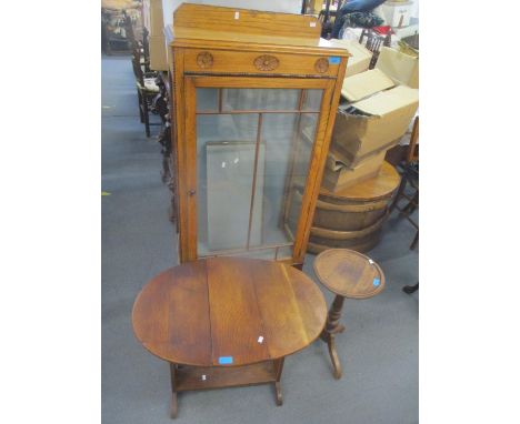 A 1930s oak display cabinet, an oak occasional table and a pedestal table 