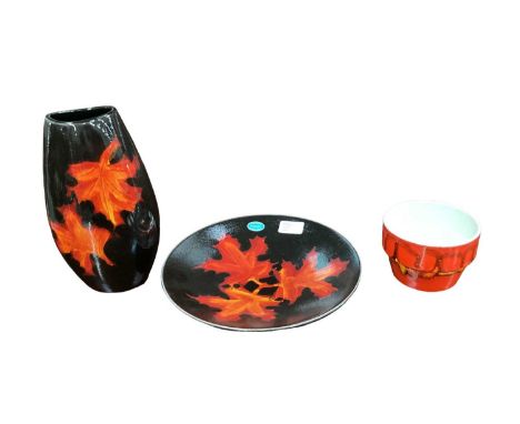 Poole Forest Flame vase, together with a matching plate, and a Poole Delphis pot (3)