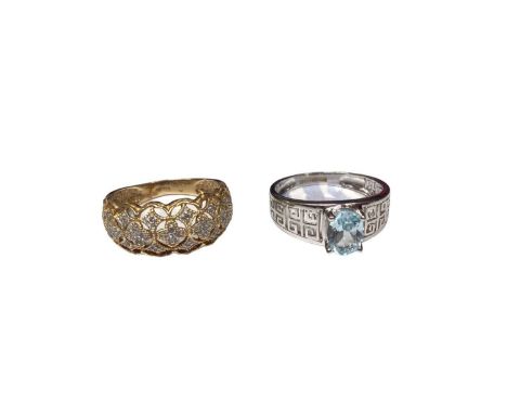 14ct gold dress ring with a diamond set pierced design and a 9ct white gold blue stone dress ring with pierced Greek key desi