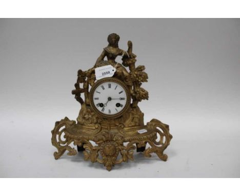 Two gilt mantel clocks and one slate clock by Fauvin, Chartres, the gilt clocks 30cm high (3)