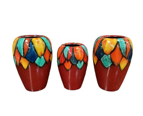 Pair of Poole pottery Harlequin Concave vases together with a smaller vase (3)