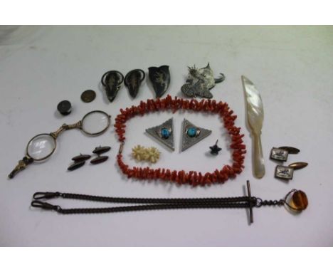 Objets vertu, including a coral necklace, mother of pearl knife, coin, etc