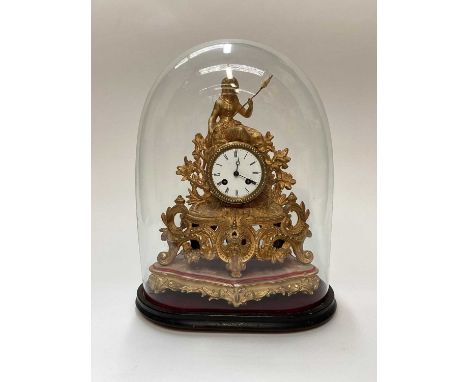 19th century gilt mantel clock, with scrollwork and foliate decoration, surmounted by a female figure, on a gilt stand and in